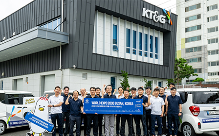 KT&G Busan staff taking a commemorative picture with a sales vehicle attached with cheering stickers