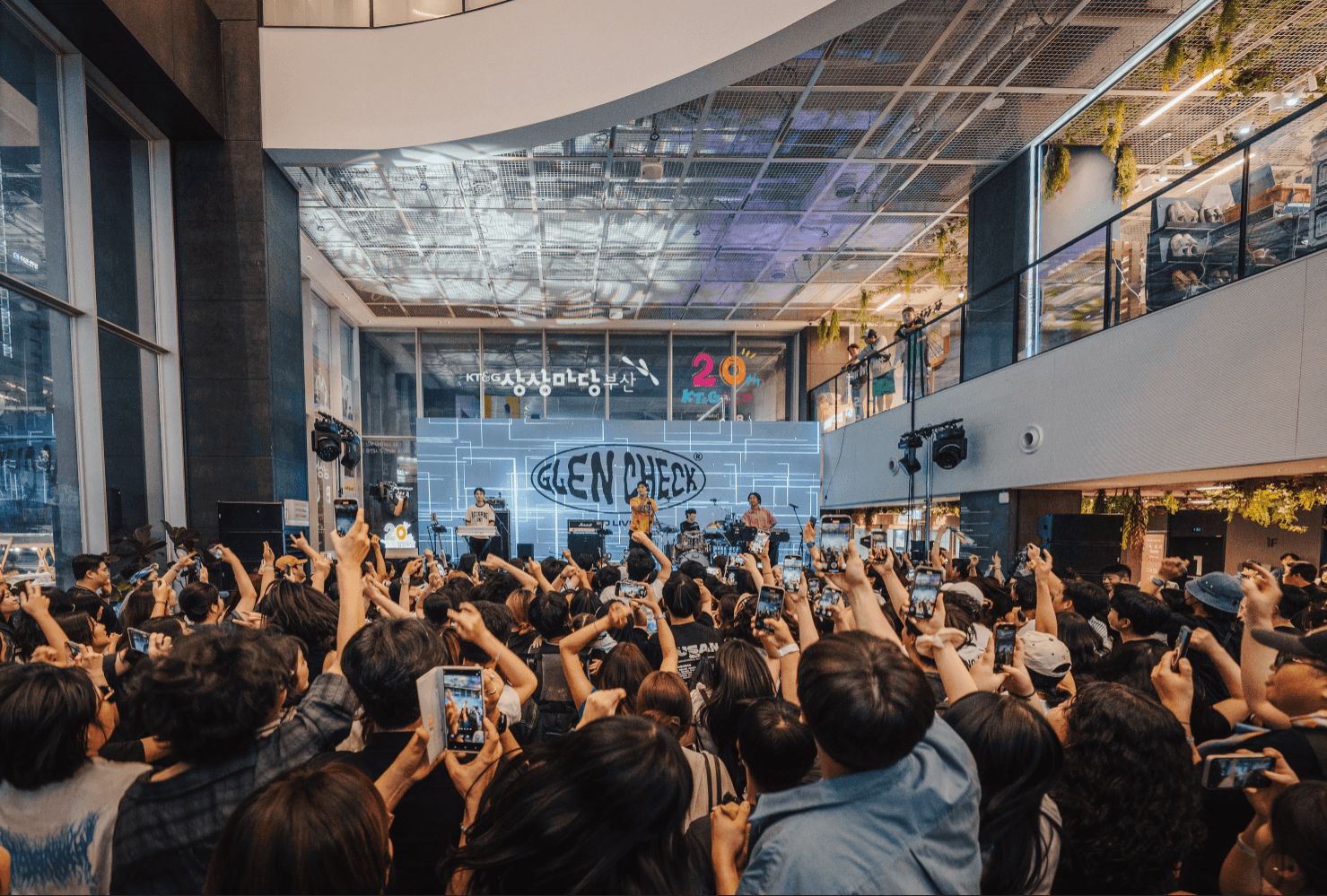 Members of the bands that participated in the festival are seen taking photographs with the audience